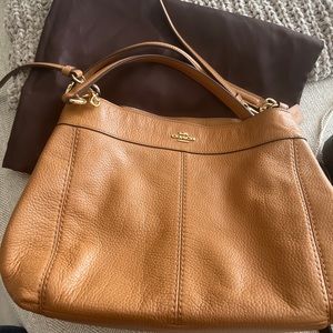 Tan Coach bag with storage bag
